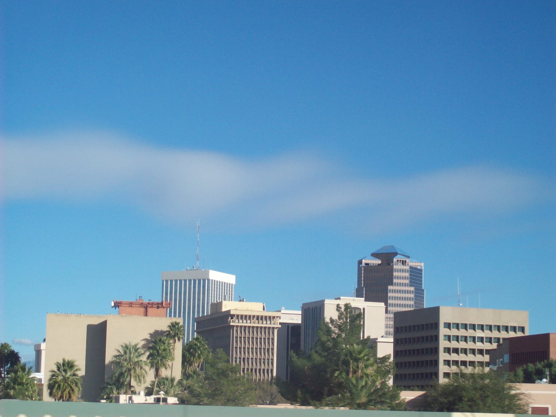 Downtown Tucson skyline beneath a blue sky